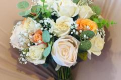 Soft pastel bouquet with cream roses and greenery bridal flower arrangement